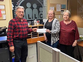 The official cheque presentation creating the fund including CFPD Board Member Blair Geisel, PLLC Executive Director Cathy Dowd and PLLC Board Chair Yvette Souque. (file photo)