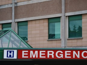 The emergency sign of a Toronto hospital is photographed on Tuesday, Sept. 27, 2022. Pediatric health-care providers say high rates of respiratory illness, dropped public health measures and health-care worker shortages are some of the factors behind unusually long wait times at children's hospitals in Ontario. THE CANADIAN PRESS/Alex Lupul
