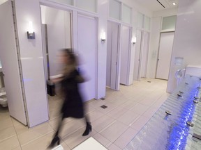 A woman walks in an all-gender washroom at Yorkdale Mall in Toronto on Tuesday, Dec. 11, 2018. THE CANADIAN PRESS/Frank Gunn