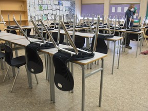 A worker cleans a classroom About 55,000 Ontario education workers such as administration staff, librarians, early childhood educators, custodians and maintenance staff could soon be in a legal strike position.&ampnbsp;THE CANADIAN PRESS/Jonathan Hayward