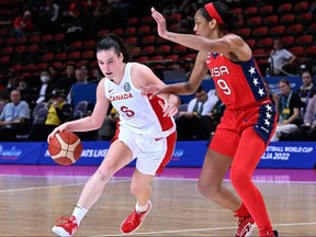Canada's Bridget Carleton, left, drives to the basket past A'Ja Wilson of the USA during the 2022 Women's Basketball World Cup semifinal game in Sydney on September 30, 2022. (Photo by WILLIAM WEST/AFP via Getty Images)