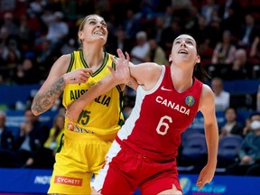 Australia's Cayla George, left, competes with Canada's Bridget Carleton during the 2022 Women's Basketball World Cup bronze-medal game at the Sydney SuperDome on Oct. 1, 2022, in Sydney, Australia. (Photo by Andy Cheung/AFP via Getty Images)