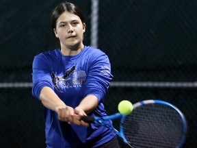 Anna Esztegar of Saint-Francois-Xavier hits a return during the girls' singles final at the LKSSAA tennis championship at the Chatham Tennis Club in Chatham, Ont., on Tuesday, Oct. 11, 2022. Mark Malone/Chatham Daily News/Postmedia Network