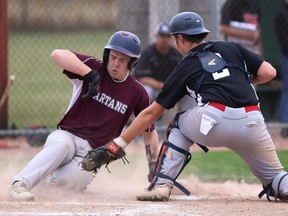 Wallaceburg Tartans' Keegan Huber beats the tag by Northern Vikings catcher Matt Schrie in the top of the sixth inning in the LKSSAA baseball championship game at Blackwell Park in Sarnia, Ont., on Tuesday, Oct. 25, 2022. Mark Malone/Chatham Daily News/Postmedia Network