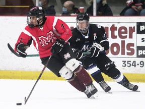 Chatham Maroons' Liam Doyle (7) is chased by London Nationals' Rylan Bowers (21) at Chatham Memorial Arena in Chatham, Ont., on Sunday, Oct. 30, 2022. Mark Malone/Chatham Daily News/Postmedia Network
