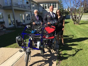 L-R: Pastor Robert Parmenter; Pat Duggan of the Royal Canadian Legion's Fort McMurray branch; and Lorna Ash, director of development for the Northern Lights Health Foundation show off a new custom-built, four-person adaptive e-bike. Photo courtesy of Northern Lights Foundation