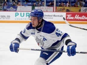 Sudbury Wolves forward Ethan Larmand keeps his eye on the play during OHL action against the Barrie Colts at Sudbury Community Arena in Sudbury, Ontario on Friday, October 14, 2022.