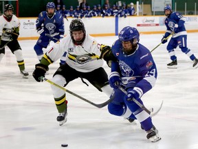Chris Innes (19) of the Greater Sudbury Cubs races for a puck against Tucker Shields (11) of the Powassan Voodoos during first-period NOJHL action at Gerry McCrory Countryside Sports Complex in Sudbury, Ontario on Thursday, October 20, 2022.