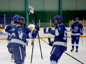 Greater Sudbury Cubs forwards Billy Biedermann (93), Pierson Sobush (91) and Oliver Smith (67) celebrate a goal during first-period NOJHL action against the Powassan Voodoos at Gerry McCrory Countryside Sports Complex in Sudbury, Ontario on Thursday, October 20, 2022.