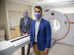 Dr. Jonathan Romsa, chief, division of nuclear medicine, left, and Stephen Nelli, co-ordinator of nuclear medicine at LHSC, are part of a team that has been preparing for 18 months for the arrival of a new PET/CT scanner at Victoria Hospital in London. Photograph taken Wednesday, Oct. 5, 2022. (Derek Ruttan/The London Free Press)