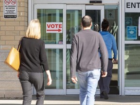 People enter the Reeves Community Complex where there was a polling station for the municipal election in Woodstock Ont. on Monday October 24, 2022. (Derek Ruttan/The London Free Press)