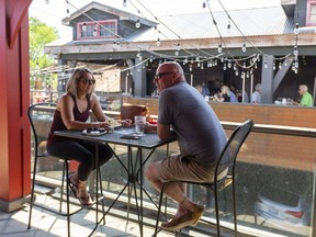 Customers dine on the upstairs patio at Joe Kool's in downtown London in this file photo from June 11, 2021. (Mike Hensen/The London Free Press)