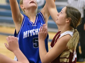 Mallory Feeney (5) of the Mitchell District high school varsity basketball team goes up for a shot against Theriault (from Timmins) during action from the St. Mike's senior tournament Oct. 14 at MDHS. The Blue Devils lost all three games they played in the high calibre event, falling also to Lasalle, from Kingston, and Waterloo Oxford. ANDY BADER/MITCHELL ADVOCATE