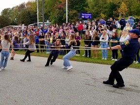 Teams of OSDSS students competed to see which team could pull the fire truck over the finish line fastest during a fundraiser for the Terry Fox Foundation Thursday, Oct. 6, 2022 in Owen Sound, Ont. (Scott Dunn/The Sun Times/Postmedia Network)