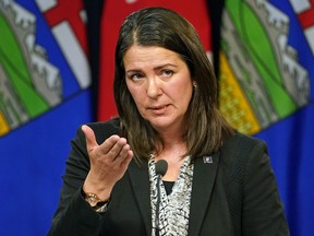Danielle Smith speaks to media after being sworn in as Alberta’s new premier in Edmonton on October 11, 2022.