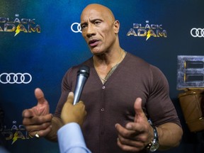 Dwayne The Rock Johnson holds court with the media at the Canadian premiere of Black Adam at Cineplex’s The Rec Room in Toronto on Thursday October 13, 2022. The first-ever feature film to explore the story of the DC’s Black Adam comes to life in all new superhero movie. It comes to theatres on Oct. 21. During the event Johnson thrilled fans and awarded a two lucky attendees a trip to Los Angeles. He signed autographs and took selfies and told the crowd, “When we kicked off this Black Adam world tour, I could not wait to come back to Toronto”. Ernest Doroszuk/Toronto Sun/Postmedia
