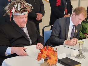 Mohawks of the Bay of Quinte Chief R. Donald Maracle and federal Minister of Crown-Indigenous Relations Marc Miller sign a historic deal in Tyendinaga Mohawk Territory on Monday morning, settling a portion of a decades old land claim dispute on the reserve. The deal also sees the Mohawks of the Bay of Quinte compensated financially for loss of use. (Jan
Murphy/Local Journalism Initiative)