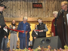 The Norwood Fair made its incredible return after two years this past weekend. Norwood's Shelia Stanley cuts the ribbon during the opening ceremonies to officially open the 2022 Norwood Fair. The Stanley family has a long standing local dairy farm and has been involved with the fair for over 50 years. Holding the ribbon is Shelia's grandson Evan and great grandson Jackson, her son Mark and his wife Suzie watch the ceremonial cutting from behind the podium. SUBMITTED PHOTO