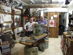 Steve Hannah and Billy Collingridge stand inside their eclectic and esoteric shop, Happy Buddah on Front Street in Belleville's Downtown District. VIC SCHUKOV PHOTO