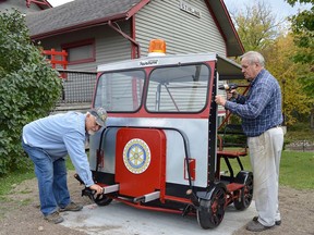 Stirling Rotarians, Dan Armstrong (left) and Bill Vaughan are pictured here putting the finishing touches on one of the two "speeders" that were added as static displays at the Stirling railway station site just two weeks ago. The addition of these authentic vehicles will help preserve and enrich the historical integrity of the site that has been lovingly restored by the Rotary Club of Stirling. TERRY VOLLUM PHOTO
