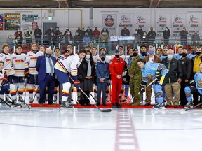 Snowbird Captain Richard MacDougall, Trenton Golden Hawks, Wellington Dukes and other special guests during the puck drop at the Duncan McDonald Memorial Gardens  prior to a Hasty P's Cup contest last season. The third annual edition kicks off Friday night in Wellington. Amy Deroche / OJHL Images