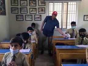 Brantford pharmacist Anwar Dost visits one of the schools he and his wife, Dr. Ismat Dost, have established in Pakistan. He recently returned home from a trip to Pakistan where he delivered food and medicine to those displaced by severe flooding.