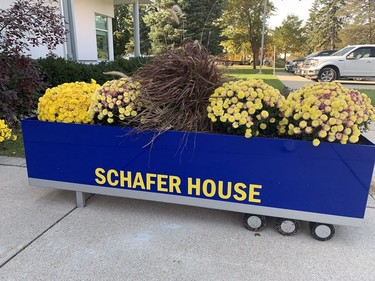 A floral display greets vistors to the Schafer House, the former Delhi Research Stationm which has been transformed into apartments for Ukrainian families who have come to Norfolk County to get a new start following the invasion of their homeland by Russian forces. Vincent Ball