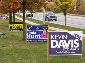 Voters in Brantford and Brant County go to the polls on Monday. Candidate signs are posted along Brantford's Wayne Gretzky Parkway at Elgin Street.
 Brian Thompson