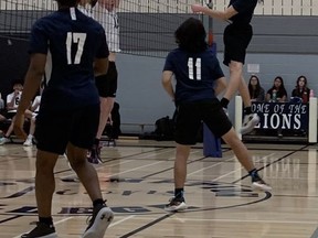 Daniel Smuk of the Assumption College goes up for a hit against St. John's College earlier this week in Athletic Association of Brant, Haldimand and Norfolk senior boys volleyball action. Twitter @