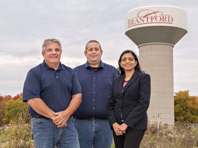 Duane Ayres (left), manager of water operations; Jim Young, manager of water distribution and wastewater collection; and Selvi Kongara, director of environmental services for the City of Brantford stand by a new water tower on Shellard Lane in Brantford. Brian Thompson/Brantford Expositor/Postmedia Network