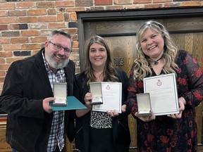 Dave Carrol, Patti Berardi (centre) and Nicole Callander are among 53 people who received Queen Elizabeth Platinum Jubilee awards on Friday night from Brantford-Brant MP Larry Brock.