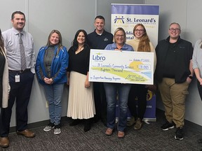 Representatives from St. Leonard's Community Services receive an $18,000 grant from Libro Credit Union in support of the agency's supportive housing programs. Submitted