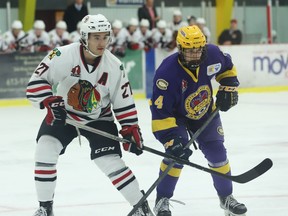 Luke Tchor (left) of Brockville and Charles-Antoine Gagne of Carleton Place interact during the Braves-Canadians game at the Brockville Memorial Centre on Friday night. Tchor picked up three assists in the Braves' 5-3 loss.
Tim Ruhnke/The Recorder and Times/Postmedia Network