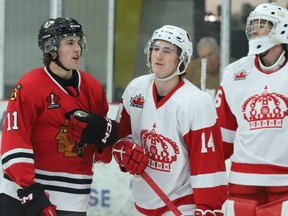 From left, Kyle Powers of Brockville interacts with Lucas Legault in front of goalie Ben Forget and the Pembroke net during the first period of the Braves-Lumber Kings game at the Brockville Memorial Centre on Friday, Oct. 28, 2022.
Tim Ruhnke/The Recorder and Times/Postmedia Network