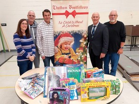 The Chatham Goodfellows 'No Child Without A Christmas' campaign will be packing toys in the former Monsignor Uyen Catholic School in Chatham. The volunteer organization is already getting set up in the school. Seen here from left are toy campaign co-chairs Barb Smith, Kevin Shaw and Tim Haskell with Scott Johnson, St. Clair Catholic District School Board director of education, and Craig Williston, Goodfellows president. Ellwood Shreve/Postmedia
