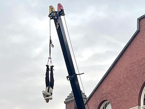 Rob Roy Collins thrilled those who watched him escape from a straightjacked while suspended high above the ground by a crane on Wednesday. Rob Roy's Great Crane Escape kicked off the inaugural Crowfest in downtown Chatham in the parking lot of The Chatham Armoury. (Handout)