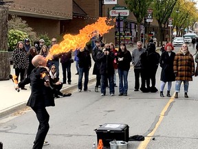 Busker David Boelee, known as Pyromancer, displays his fire breathing skills during Crowfest in downtown Chatham on Saturday. PHOTO Ellwood Shreve/Chatham Daily News