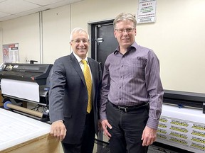 David Dawson, right, owner of Instant Print & Promo, enjoyed the opportunity to give Vic Fedeli, Minister of Economic Development, Job Creation and Trade of Ontario, a tour of his Chatham business. PHOTO handout