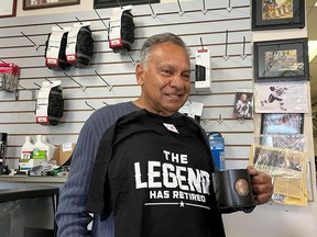 Parminder "Cookie'' Kalsi, at his soon-to-be-closing Kalrim Cycles and Sports store, with a t-shirt sent to him from a friend in Calgary. Photo in Cornwall, Ontario. Todd Hambleton/Cornwall Standard-Freeholder/Postmedia Network