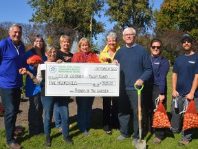 Cornwall Mayor Glen Grant, Cornwall and District Horticultural Society members, and City employees gathered for a cheque presentation that will result in more tulips in bloom next spring. Shawna O'Neill/Cornwall Standard-Freeholder/Postmedia Network