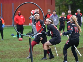 Players for Carleton University (black uniforms) and McGill University (red) in a game of quidditch. Handout/Cornwall Standard-Freeholder/Postmedia Network
