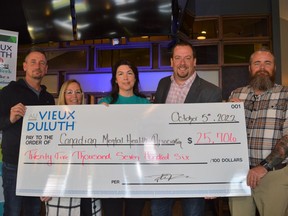 Canadian Mental Health Association Champlain East raised over $25,000 at a recent Fundraising Dinner. Pictured from left to right, Stephane Loyer of Devcore Group, Chrystal Mongillo, CMHA Champlain East mental health promoter Angele D'Alessio, Au Vieux Duluth Cornwall owner Alexandre Paradison, and CMHA Champlain East manager of mental health promotion Jason Pollick. Pictured on Tuesday October 18, 2022 in Cornwall, Ont. Shawna O'Neill/Cornwall Standard-Freeholder/Postmedia Network