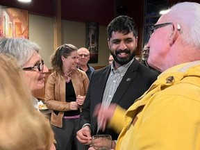 Mayor-elect Justin Towndale (middle) accepts congratulations from some of the supporters at his post-election party on Monday night in Cornwall. Photo on October 24, 2022. Todd Hambleton/Cornwall Standard-Freeholder/Postmedia Network