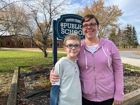 Jack Daye with his mom Dara Daye, in front of Longue Sault Public School. Photo on Wednesday, October 26, 2022. Todd Hambleton/Cornwall Standard-Freeholder/Postmedia Network