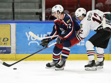 Cornwall Colts Cade McCrate fends off Brockville Braves Jack O'Rourke on Thursday October 27, 2022 in Cornwall, Ont. Cornwall lost 4-1. Robert Lefebvre/Special to the Cornwall Standard-Freeholder/Postmedia Network