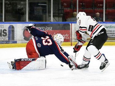 Cornwall Colts goaltender Dax Easter tries to get a glove on the puck shot by Brockville Braves Lucas Culhane on Thursday October 27, 2022 in Cornwall, Ont. Cornwall lost 4-1. Robert Lefebvre/Special to the Cornwall Standard-Freeholder/Postmedia Network