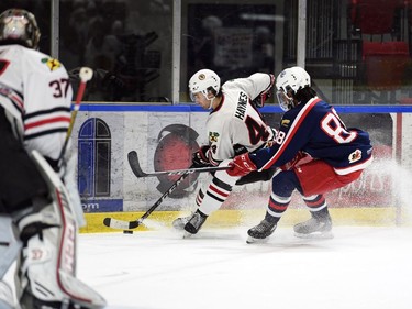 Cornwall Colts Nathan Garnier takes Brockville Braves Thomas Haynes into the boards during play on Thursday October 27, 2022 in Cornwall, Ont. Cornwall lost 4-1. Robert Lefebvre/Special to the Cornwall Standard-Freeholder/Postmedia Network