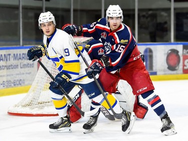 Cornwall Colts Simon Laferriere stays on Carleton Place Canadians Evan Jamieson on Thursday October 20, 2022 in Cornwall, Ont. The Colts won 6-4. Robert Lefebvre/Special to the Cornwall Standard-Freeholder/Postmedia Network