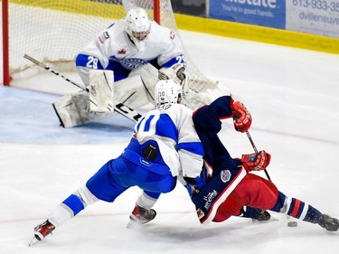 Navan Grads Joseph Ianniello brings down a Cornwall Colts player on his way to Diego D'Alessandro's crease on Thursday October 13, 2022 in Cornwall, Ont. Cornwall lost 5-3. Robert Lefebvre/Special to the Cornwall Standard-Freeholder/Postmedia Network