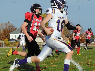 Wildcats Isaac Mainville goes stride for stride with a Gatineau Viking player on Sunday October 23, 2022 in Cornwall, Ont. Cornwall won 47-13. Greg Peerenboom/Special to the Cornwall Standard-Freeholder/Postmedia Network